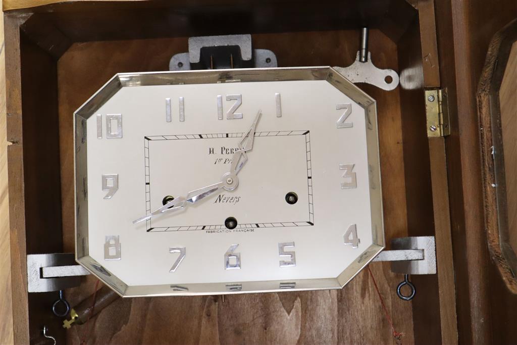 A French Art Deco walnut and chrome musical wall clock, dial signed H.Perrin, Nevers, height 59cm